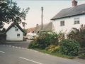 AAPC-6-1-005 -- Dunkirt Lane and Monxton Rd entrance to Dunkirt Lane from the Monxton Rd. The cars are parked outside The Old Bakery.  No 49 and Jubilee Oak Cottage in foreground